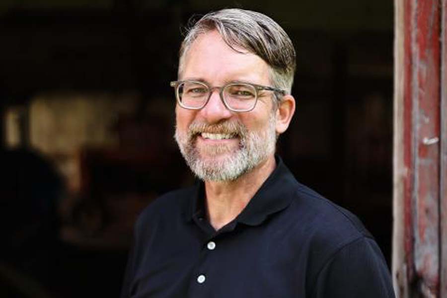 A man poses for a portrait.