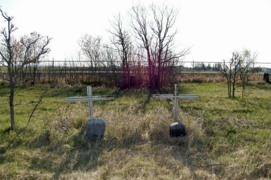 A Potter's Field cemetary east of Menomonie containing grass and gravestones