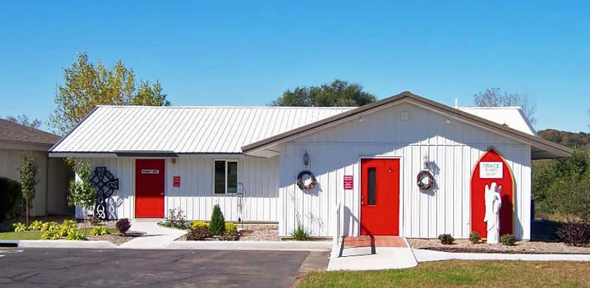 Grace Thrift Shop - White building with red doors