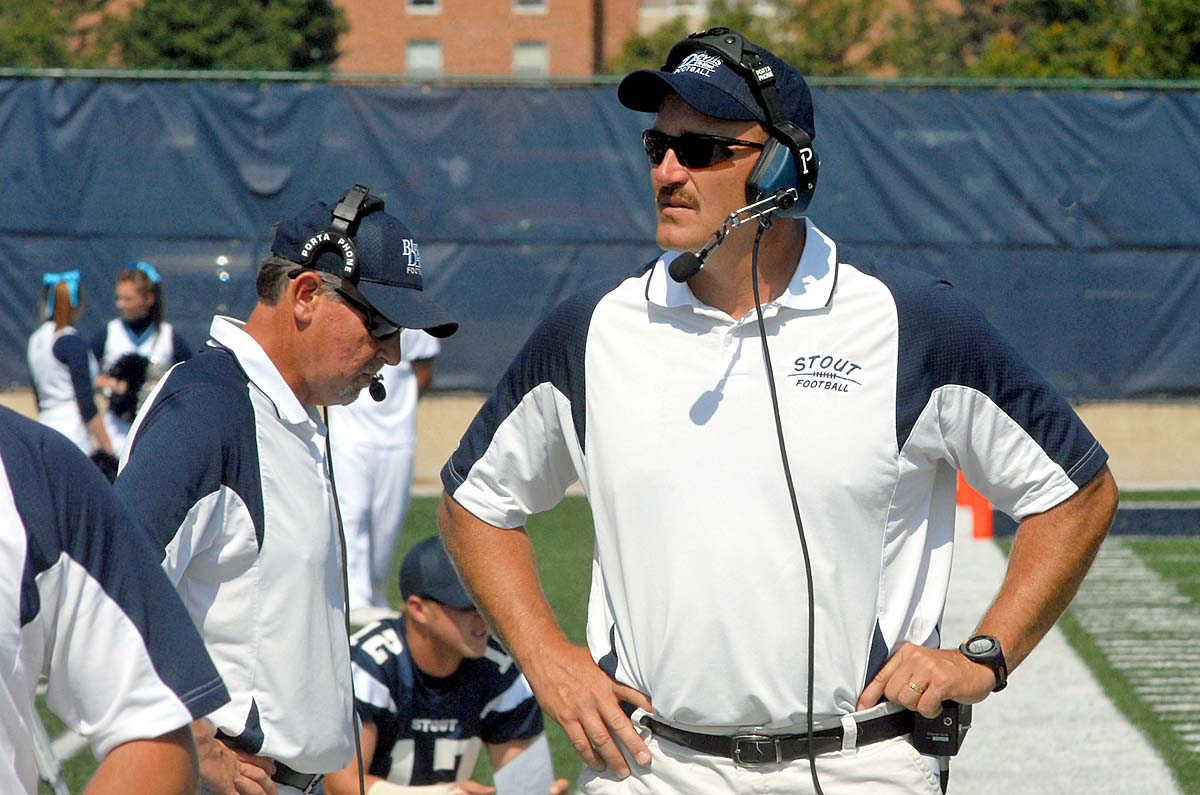 Soon to retire Duey Naatz, then the Blue Devil head football coach, looks over the sidelines during a 2009 game.