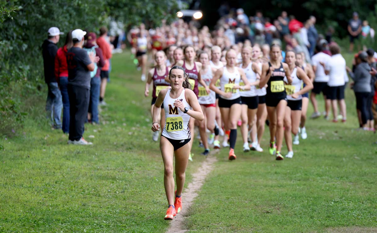 Menomonie's funner Lauren McCalla leads the group of runners at the Husky Invitational