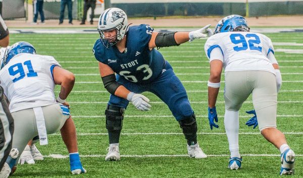 UW-Stout offensive lineman Ben Bystol points before a play.
