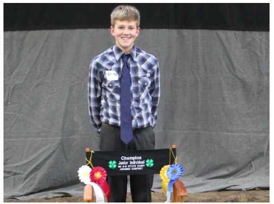 Tyler Quilling pictured with his State 4-H Junior Dairy Judging awards 