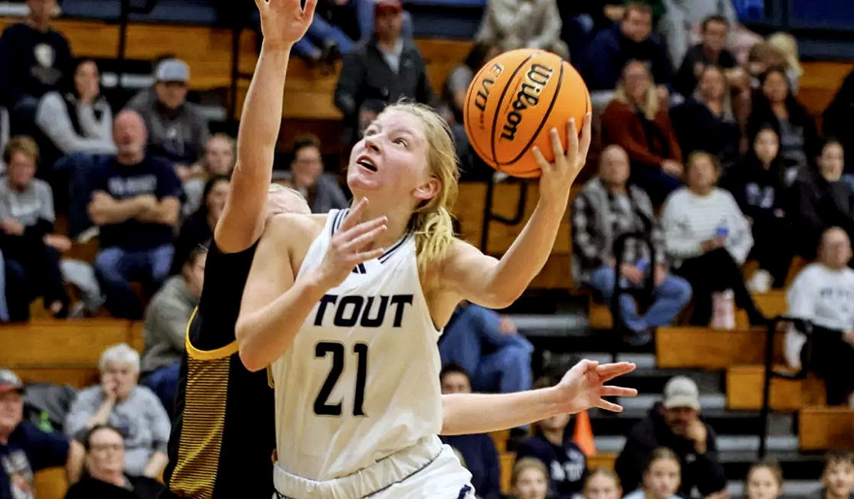 UW-Stout's Mary Berg drives to the basket with a left-handed shot.