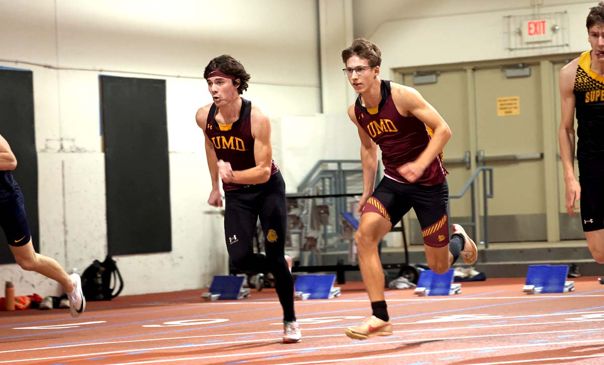 Men come out of the starting blocks at the beginning a race.