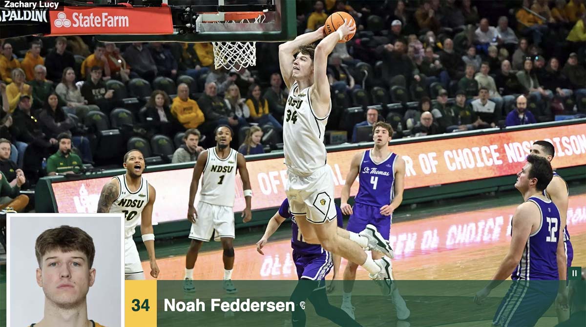 A basketball player in a white uniform leaps to dunk the basketball in an NCAA Division I game featuring North Dakota State University and the University of St. Thomas.