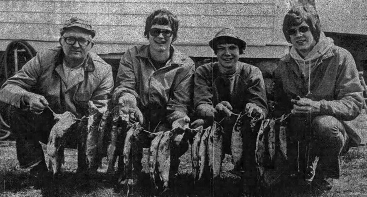 Despite the cold, rainy weather which greeted fishermen on the opening of the 1976 fishing season Saturday, the Stan Huftel family, 1104 Wilson Ave., Menomonie, hit it big. From the left are Stan, Joe, Tom and Mark who combined to catch 16 Brook and Brown trout and one bass. Fourteen of the trout ranged in size from 13 1/2 to 15 inches and the other two measured 11 inches. The bass weighed about 4 1/2 pounds. They caught the fish at Glen Lake near Glenwood City Saturday morning. May 5, 1976 Dunn County News