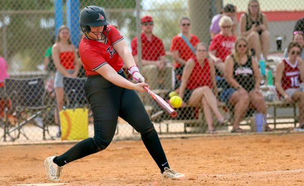 A UW-River Falls Falcon player swings at a pitch.