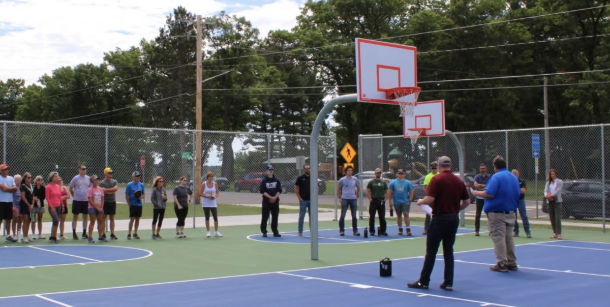 Grand reopening of the Menomonie Park courts and batting cages was held on June 19 at Wakanda Park. Here Mayor Matthew Crowe and Public Works Director David Schofield address the crowd. Facebook photo