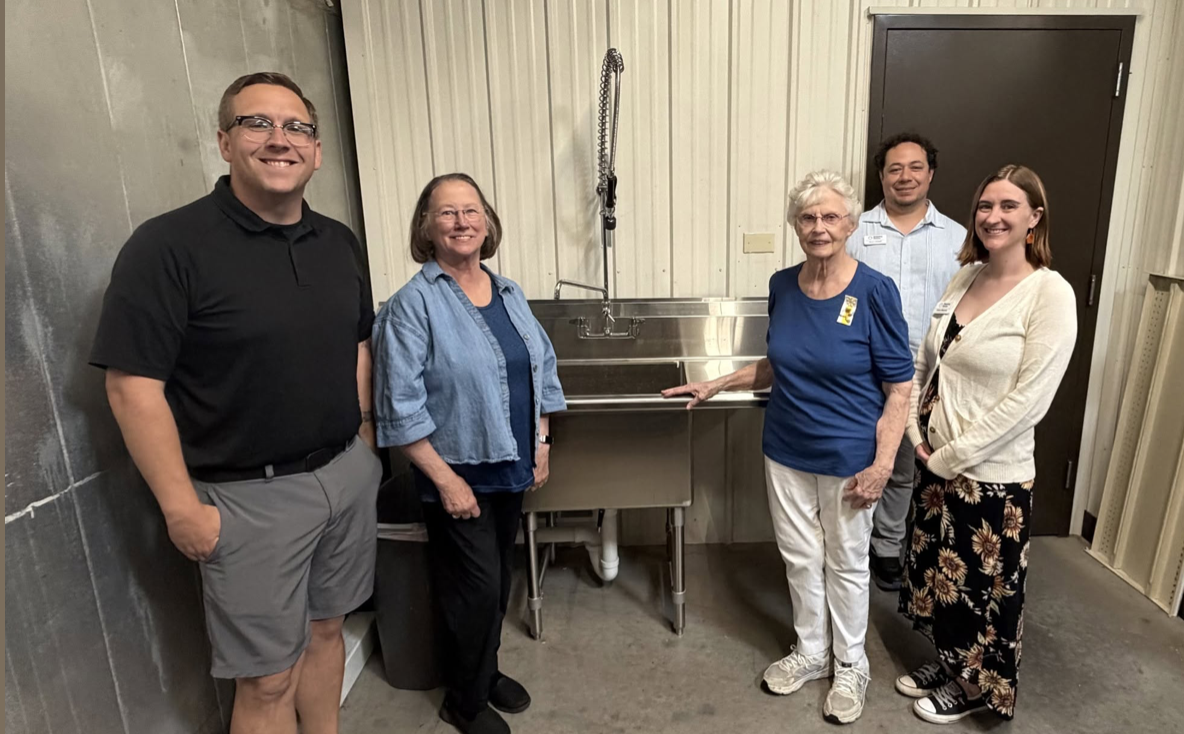 Pictured L to R: Dustyn Dubuque, Development Manager; Helen Redlich & Jan Gehring, members of P.E.O. (Philanthropic Educational Organization) Chapter DD; Aaron Leonardi, Pantry Manager; Corrisa Villeneuve, Executive Director. Facebook photo